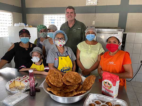 Food For The Poor President/CEO Ed Raine visits the women who work in a bakery in Honduras funded by the charity’s donors.