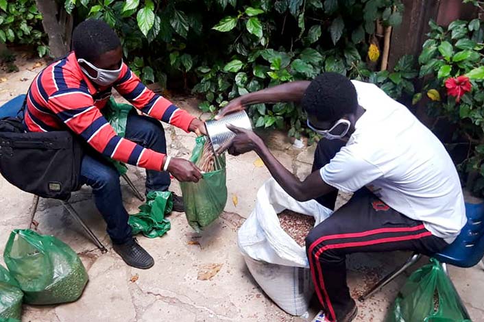 Haiti - Two males with grain bags