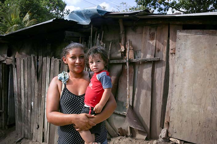 Honduras - Woman carrying a child