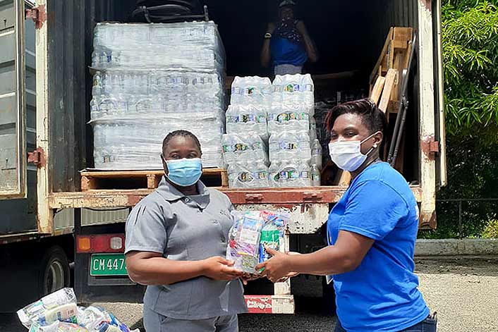 Jamaica - Female distributing food from truck